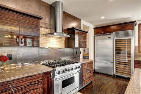 white or stainless steel with wood cabinets|kitchen cabinets with wood panels.